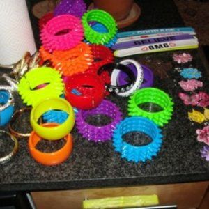 12 snake bracelets.  6 plain plastic bracelets of many colors.  16 spike bracele